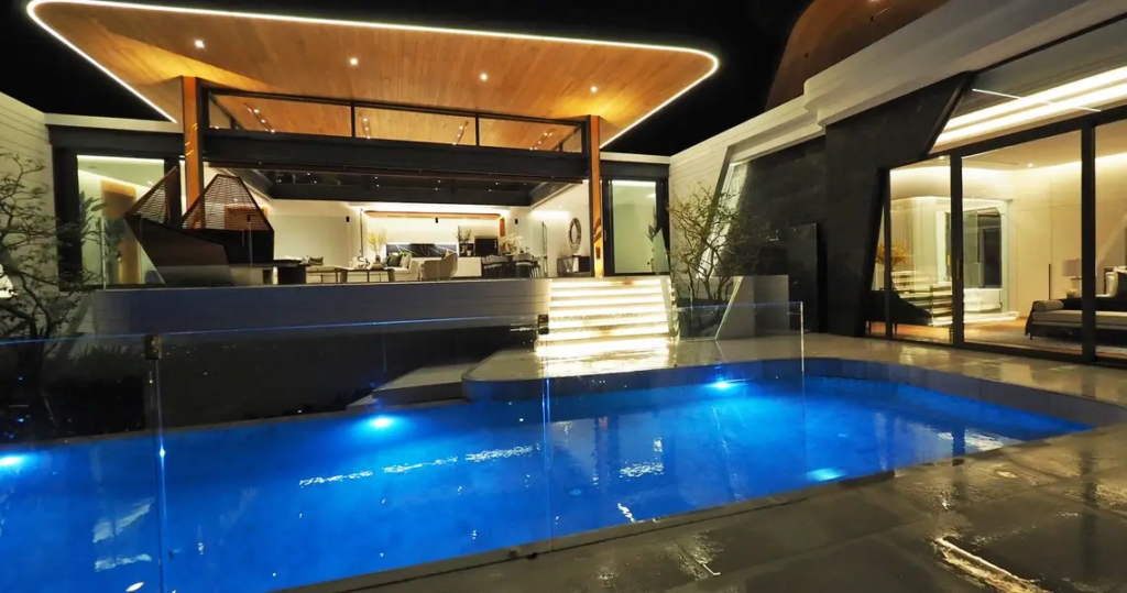 Outdoor pool and living space of luxury villa in Phuket
